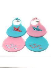 Load image into Gallery viewer, Pink and pink Silicone baby bibs with a stars and fish